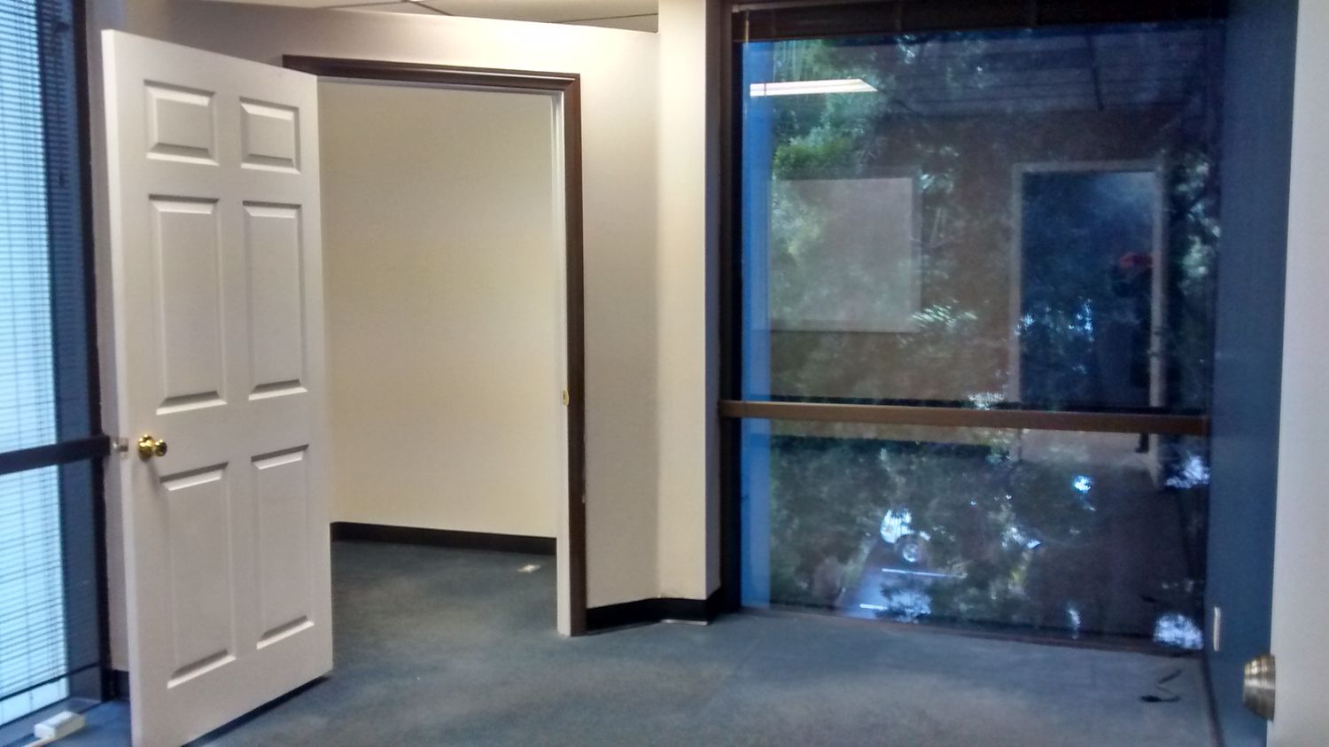 CORNER SUITE, 2 OFFICES, RECEPTION/WORK STATION, OPEN SPACE, STORAGE.